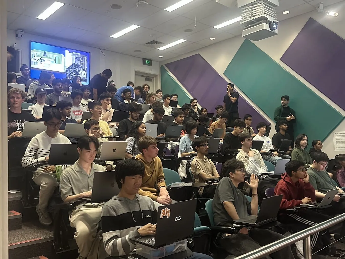 A full lecture theatre at Monash during a Monash DeepNeuron C++ workshop.